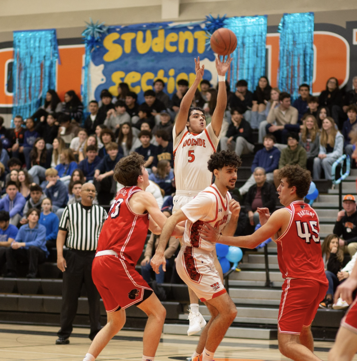 Woodside boys varsity basketball team plays Burlingame in the quad game last Friday.